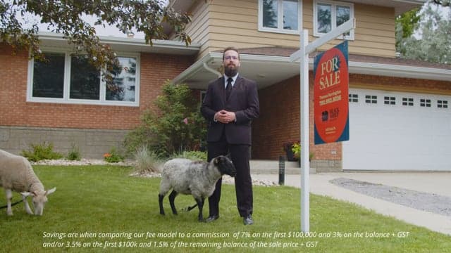 Investing in real estate, this man stands confidently outside a modern home with a "For Sale" sign, exemplifying property sales and market opportunities.