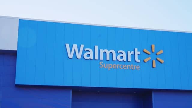 Bright blue Walmart Supercenter storefront with the store logo and yellow spark symbol in clear view.