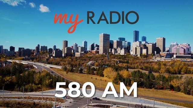 Aerial view of a city skyline with skyscrapers and parks, promoting my RADIO 580 AM station, highlighting urban broadcasting and local radio services.