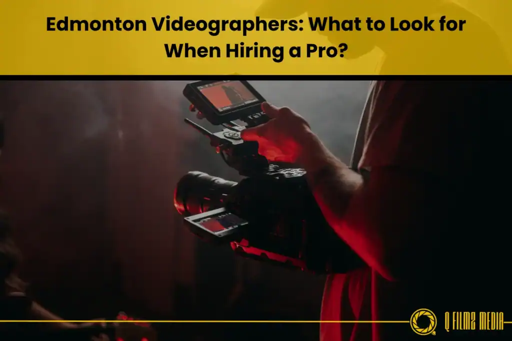 Professional videographer holding a camera and monitor in a dark studio setting for film and video production.