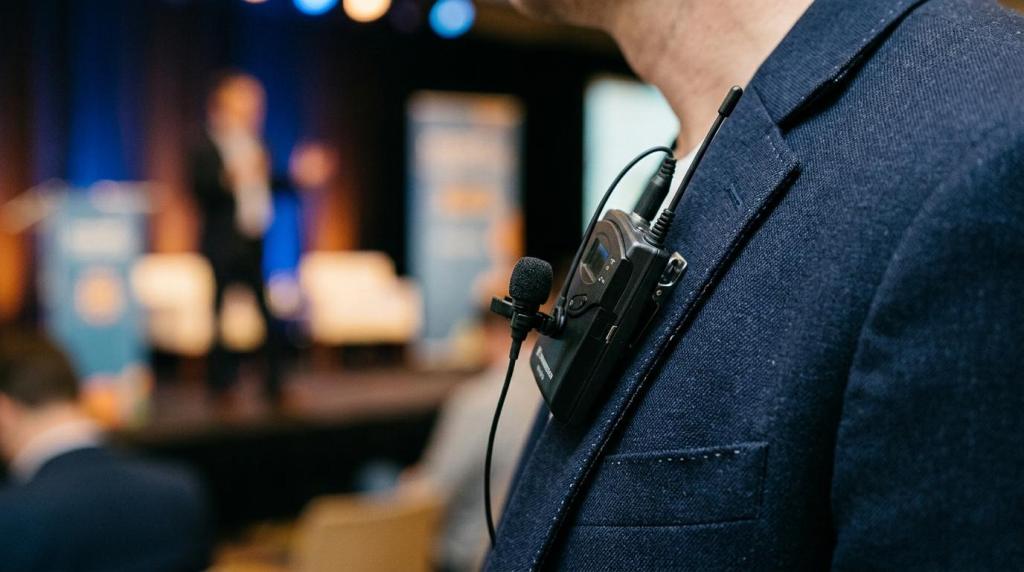 Close-up of professional videography equipment worn by a speaker at a corporate event in Edmonton.
